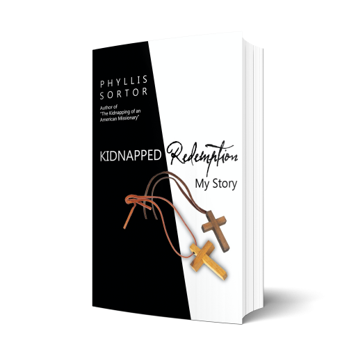 Book with Black and white cover, two wooden crosses on front. Text: Kidnapped Redemption My Story by Phyllis Sortor